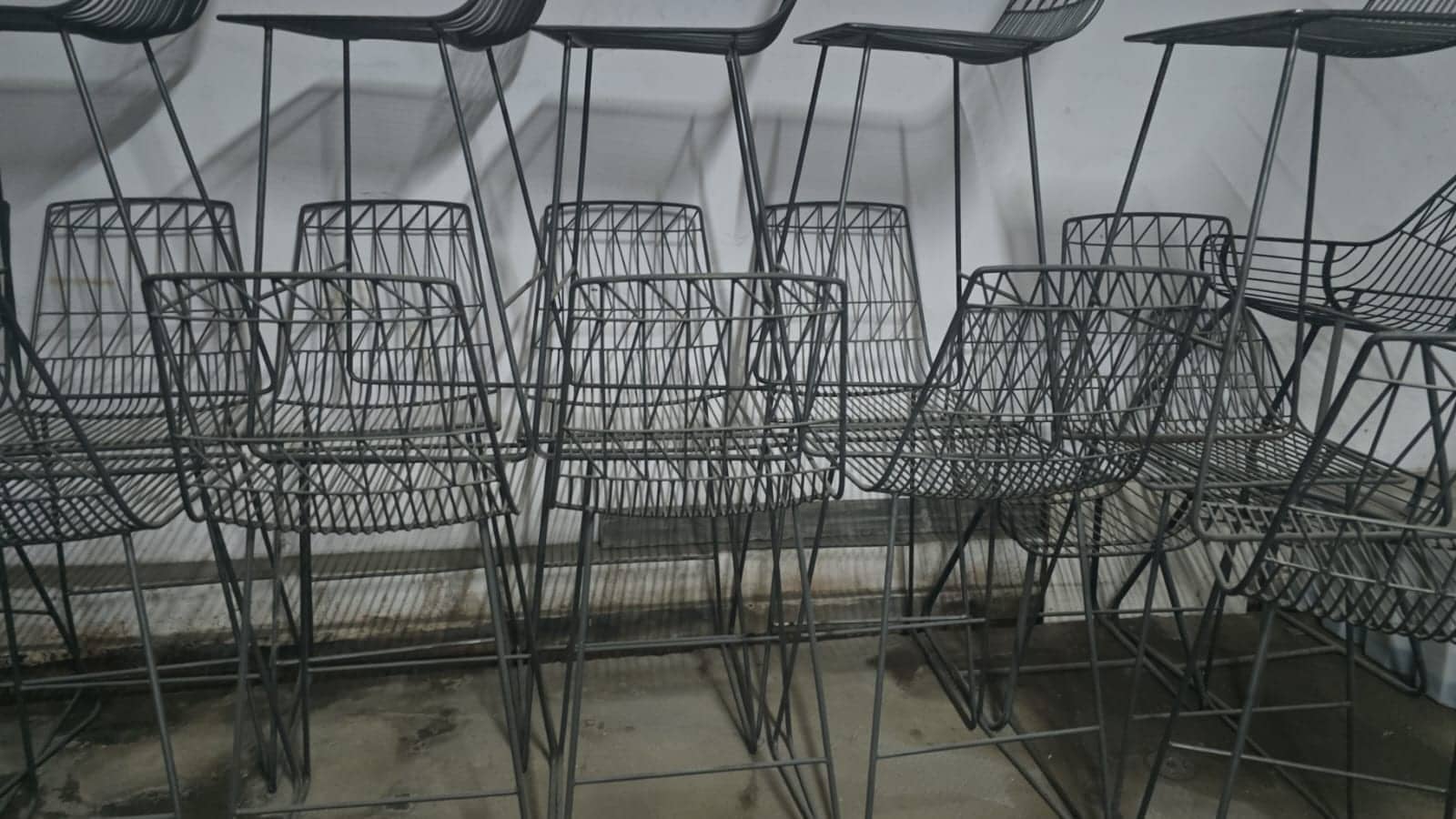 Metal wire café chairs lined up together