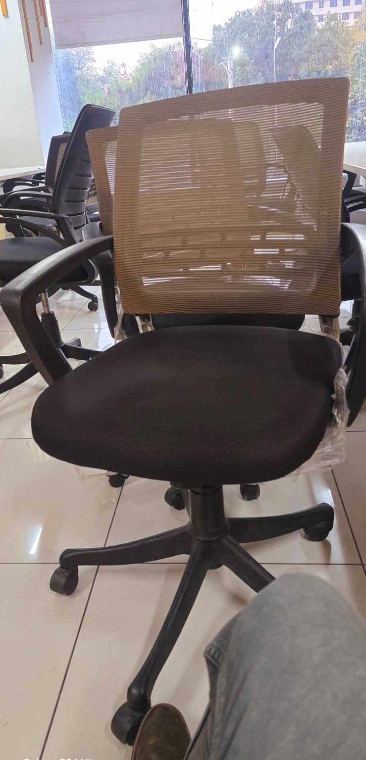 Mesh office chairs in an office