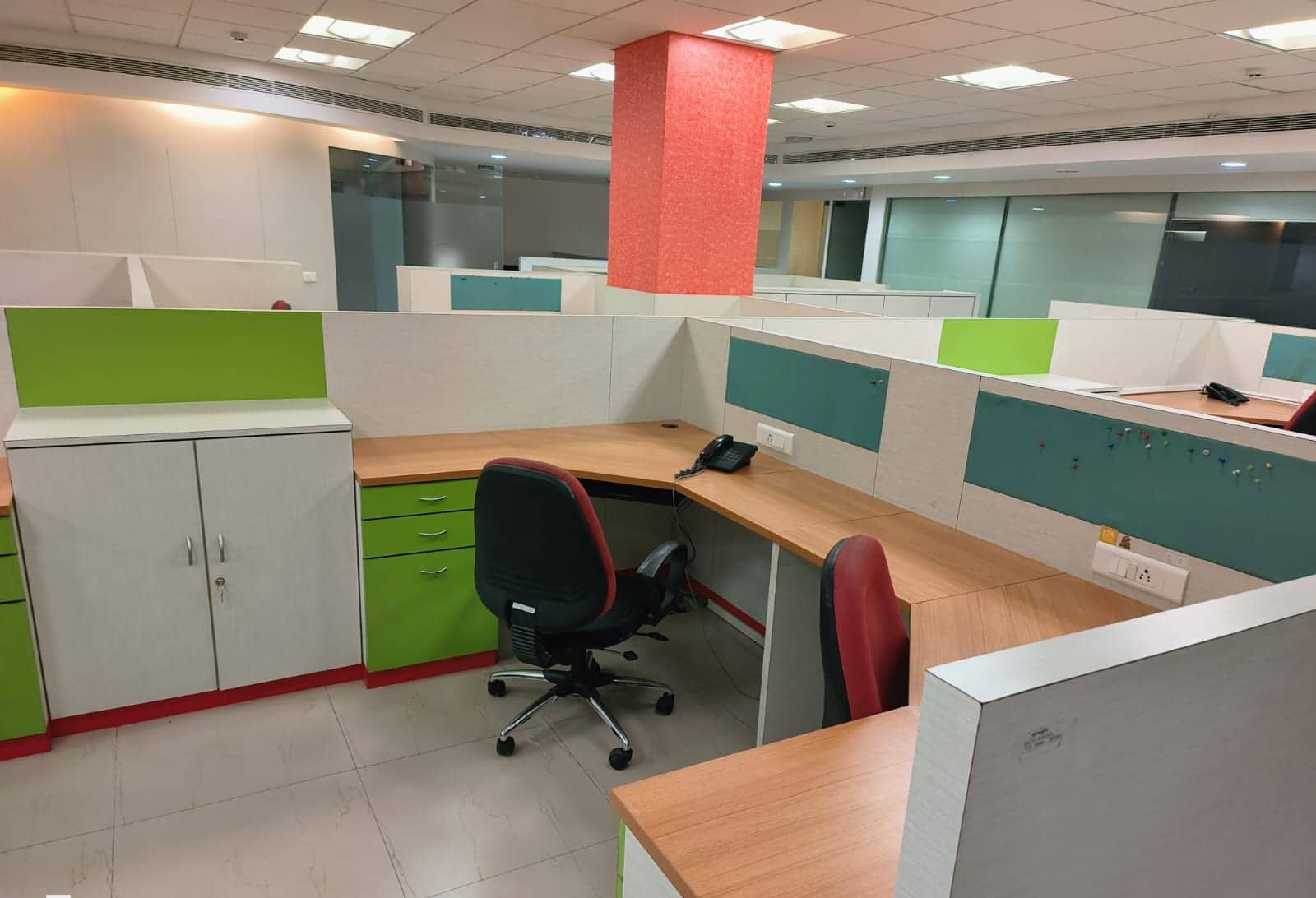 Office workstations with storage units and chairs